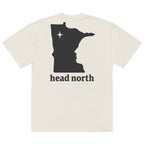 Back view of beige oversized T-shirt with black Minnesota logo and 'head north' text