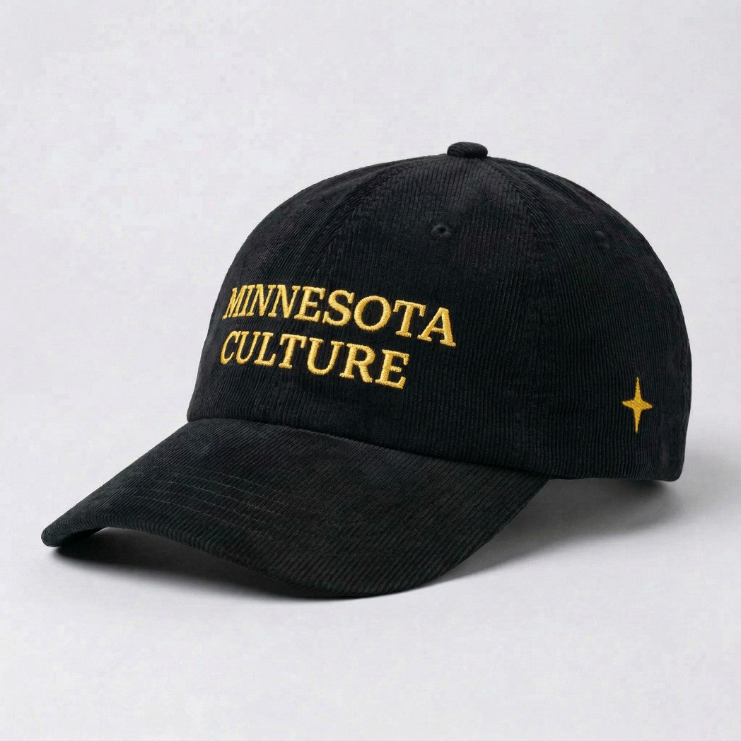 Black corduroy hat with gold embroidered "MINNESOTA CULTURE" on front, with gold embroidered 4 point north star on left panel