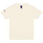 Back of a vintage-white colored t-shirt showing a small, dark blue, Minnesota-shaped logo in the upper neck area of the t-shirt