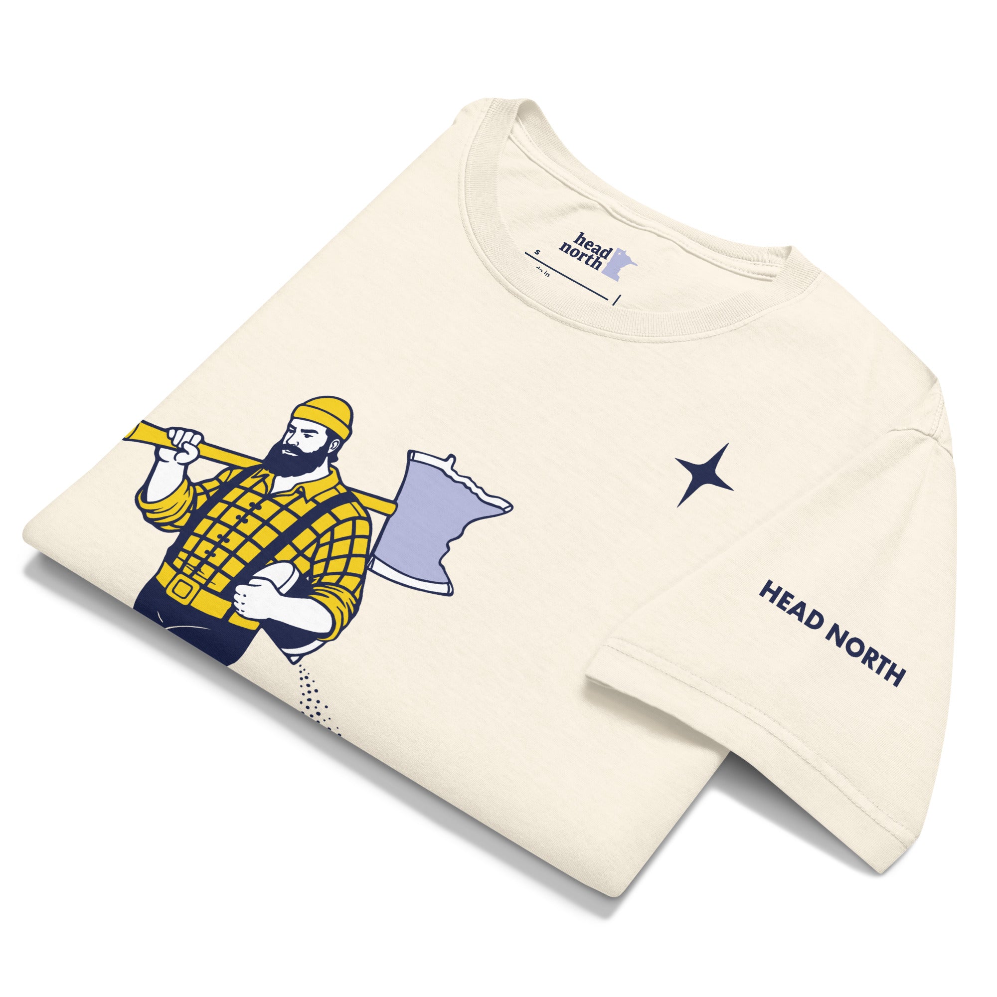 Folded, front of vintage-white colored t-shirt showing a Paul Bunyan Illustration carrying a minnesota-shaped axe, with a blue north star shape in upper right corner of design