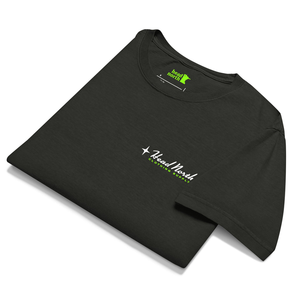 Folded, front of faded black t-shirt with Head North Clothing supply text on front left-chest area